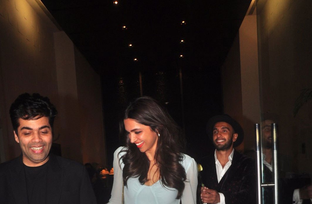 Ranveer Singh follows Deepika Padukone with a flower at Farah Khan's b'day bash