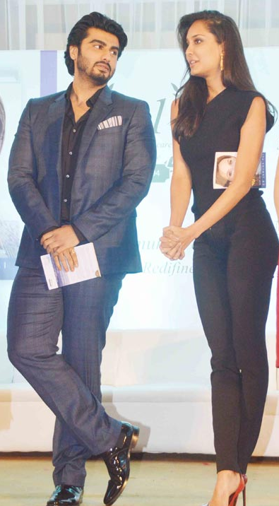 Arjun Kapoor and Lisa Haydon pose for the shutterbugs at a book launch