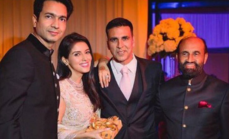 Asin and Rahul Sharma's wedding reception posing with Akshay Kumar