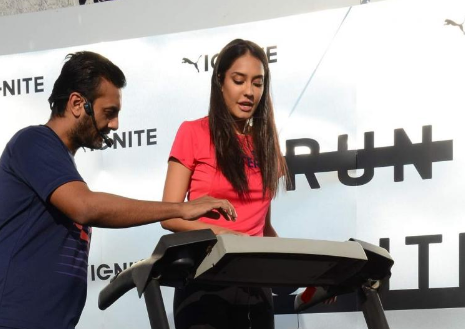 Lisa walks on a treadmill at the footwear launch