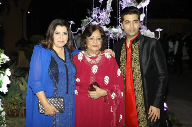 Farah Khan, Karan Johar and Hiroo Johar pose for the shutterbugs at Manish Malhotra's niece Riddhi's sangeet function