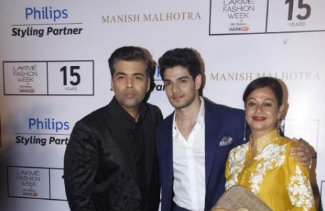 Karan Johar poses with Sooraj Pancholi and Zarina Wahab at Lakme Fashion Week 2015